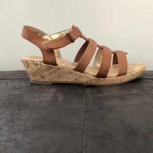 Sandals.  Kids size 3 but a woman’s size 5.